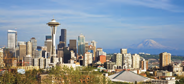 Fall 2009 - The Emerald City: Seattle Skyline The striking Seattle skyline with Space Needle left of center, forefront, and gorgeous Mount Rainier right of center, in the background.