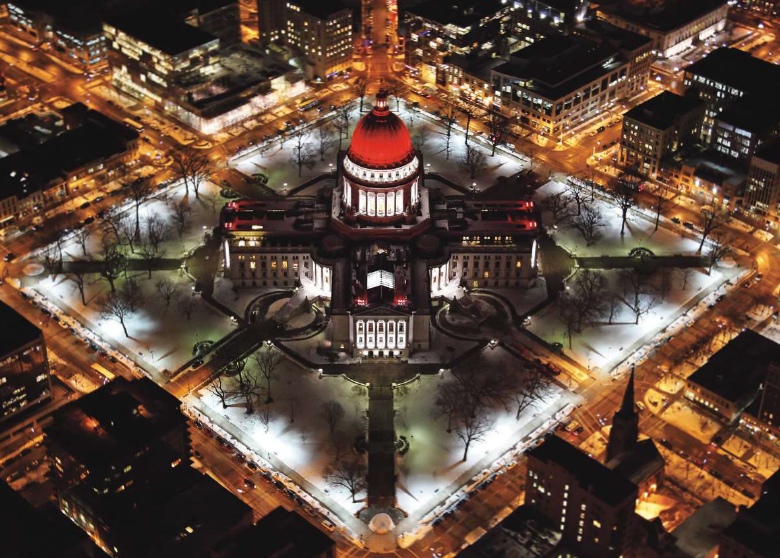 The state capitol building illuminates the heart of downtown in February as it stands tall, lit for American Heart Month.