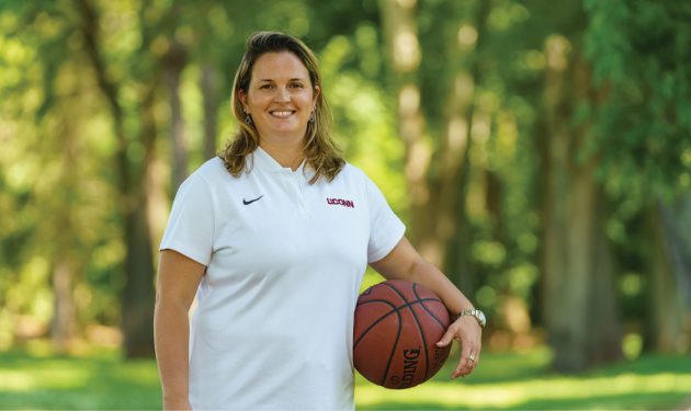 Katherine Coyner, M.D., is a team physician for several UConn teams, including women’s basketball. “I’d go as a fan, but now I get to go as the team doctor,” she says. - Photo by Butler Photography