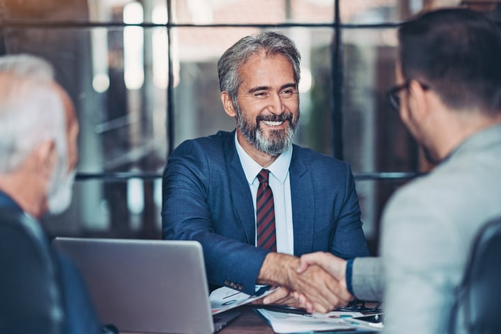 Businessmen handshake in the office