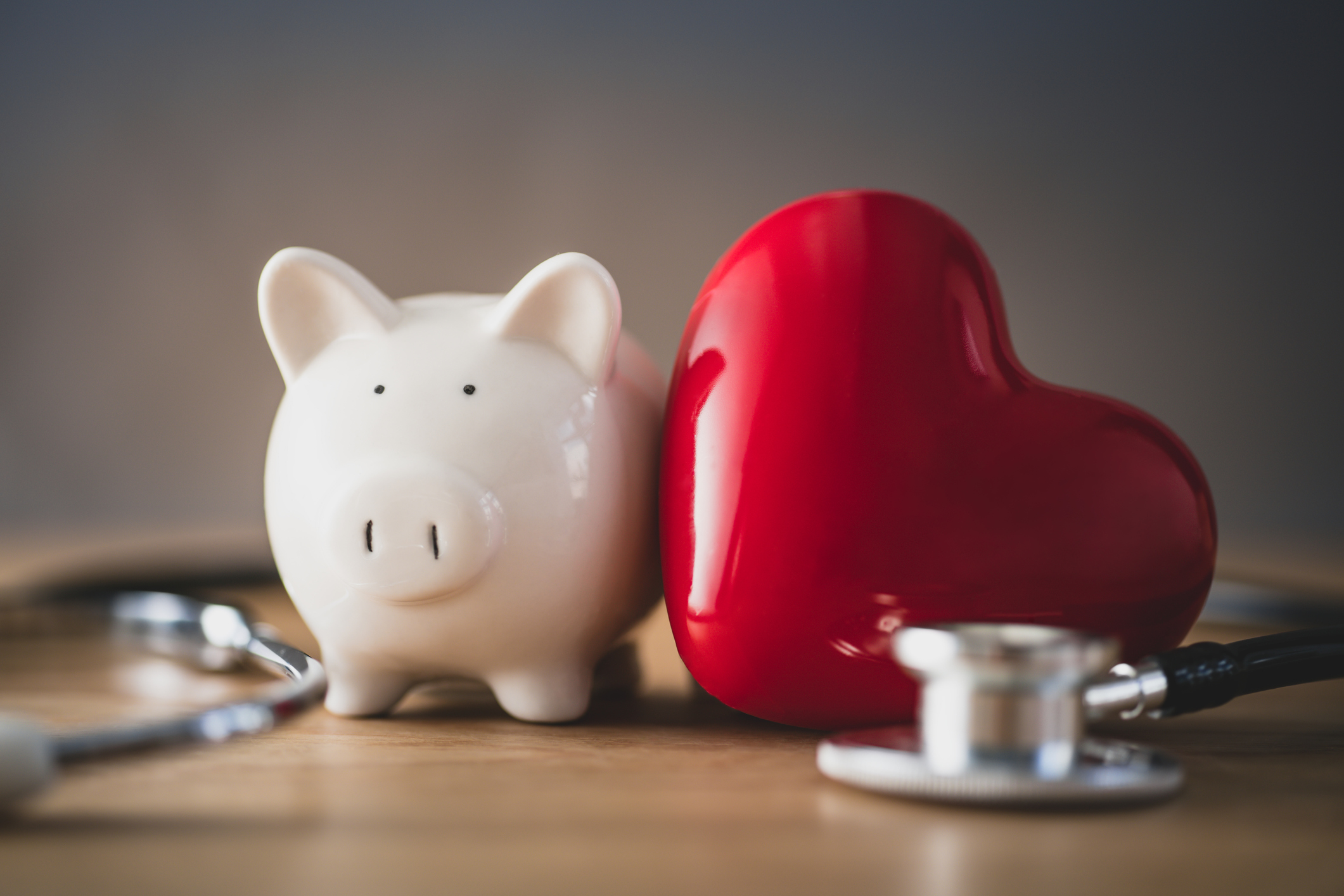 Piggy bank with red heart