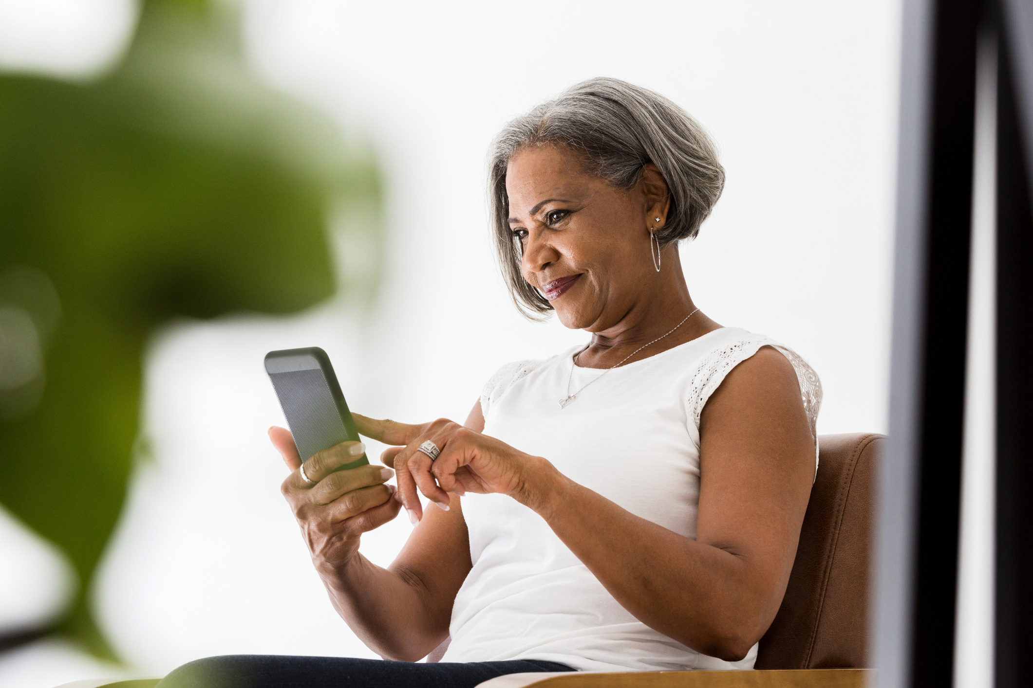 Woman participates in video call with family